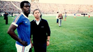 French team coach Michel Hidalgo (R) gestures next to French player Marius Tresor at Gerland Stadium in Lyon, on May 17, 1982. (Photo by Luc NOVOVITCH / AFP) (Photo credit should read LUC NOVOVITCH/AFP via Getty Images)