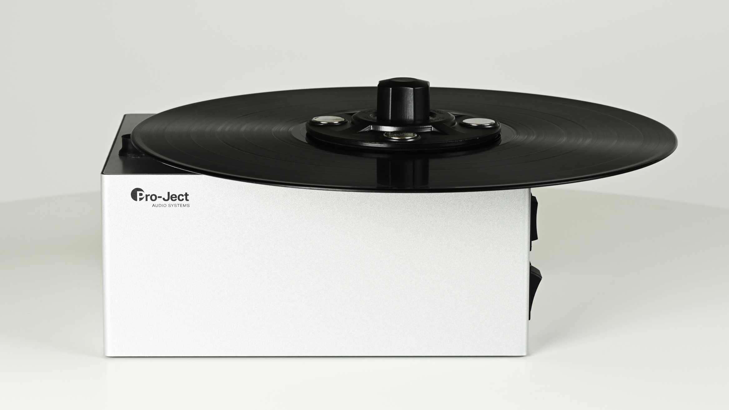 The Pro-Ject VC-E Mini on a table, with a white background.