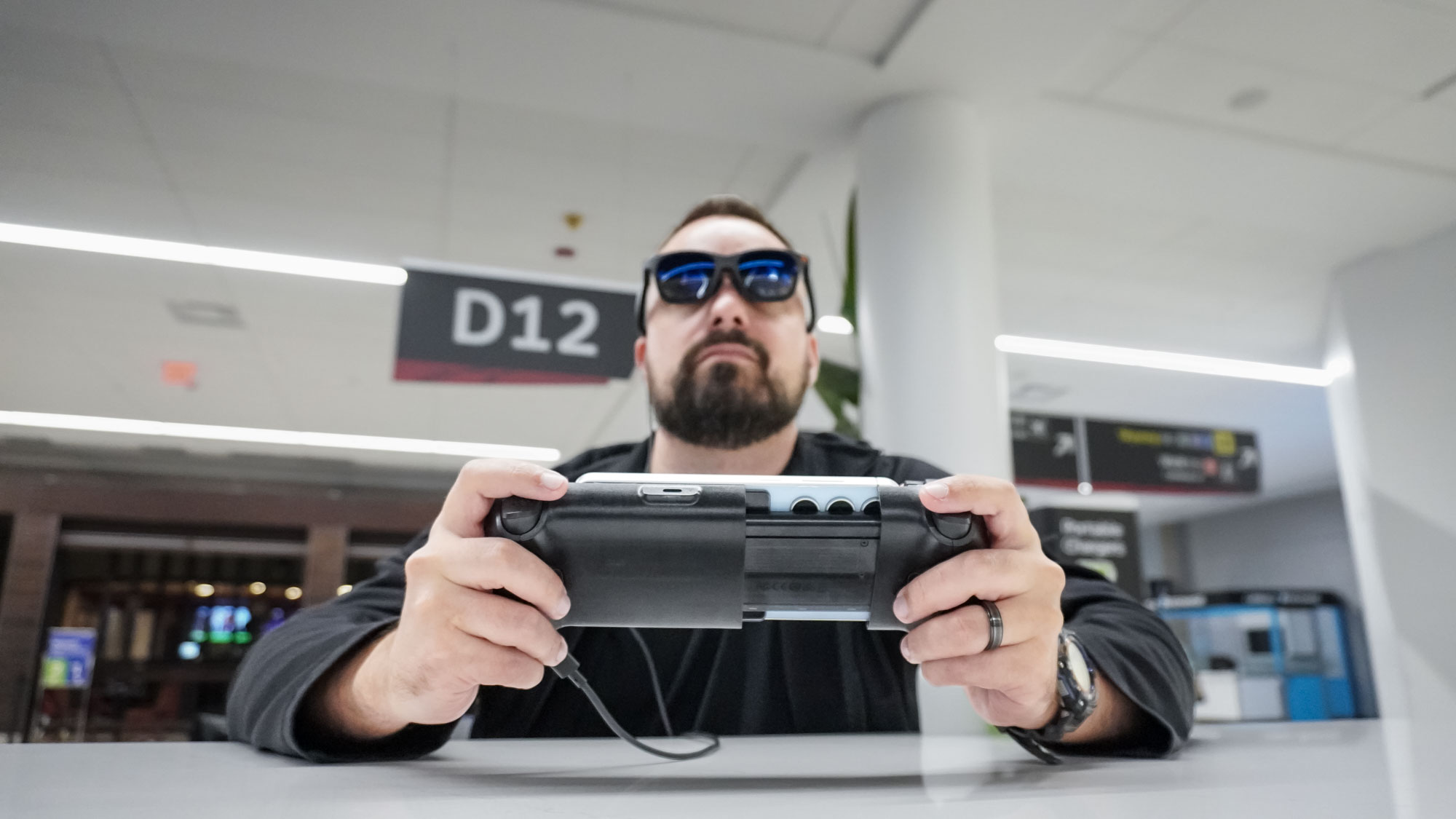 Using the Viture x 8BitDo Ultimate Mobile Gaming Controller with AR glasses in an airport terminal