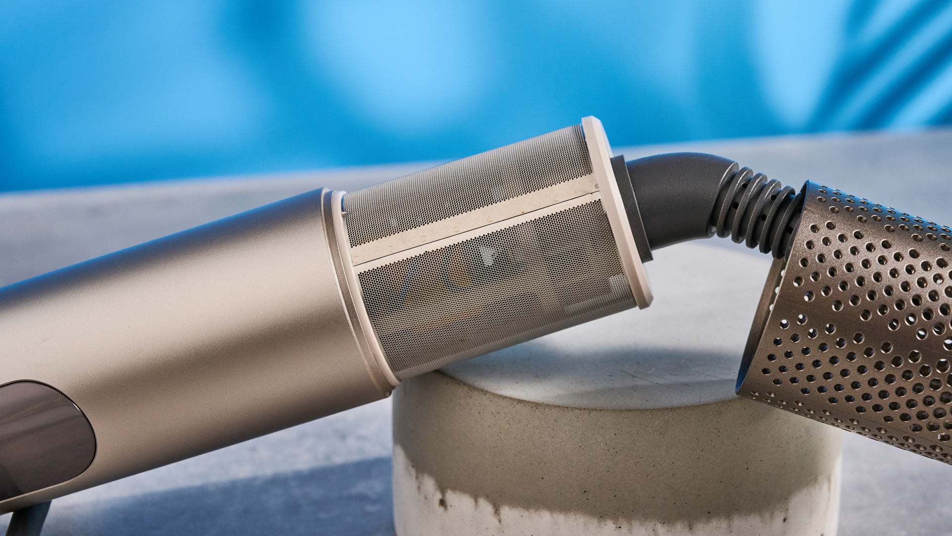 Dreame Dazzle air styler photographed in front of a blue background