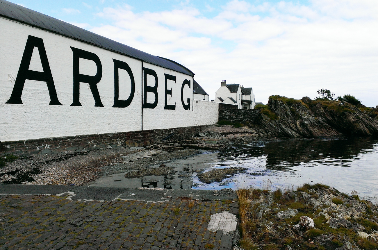 View of the Ardbeg whisky distillery by the sea with Seaview Cottage
