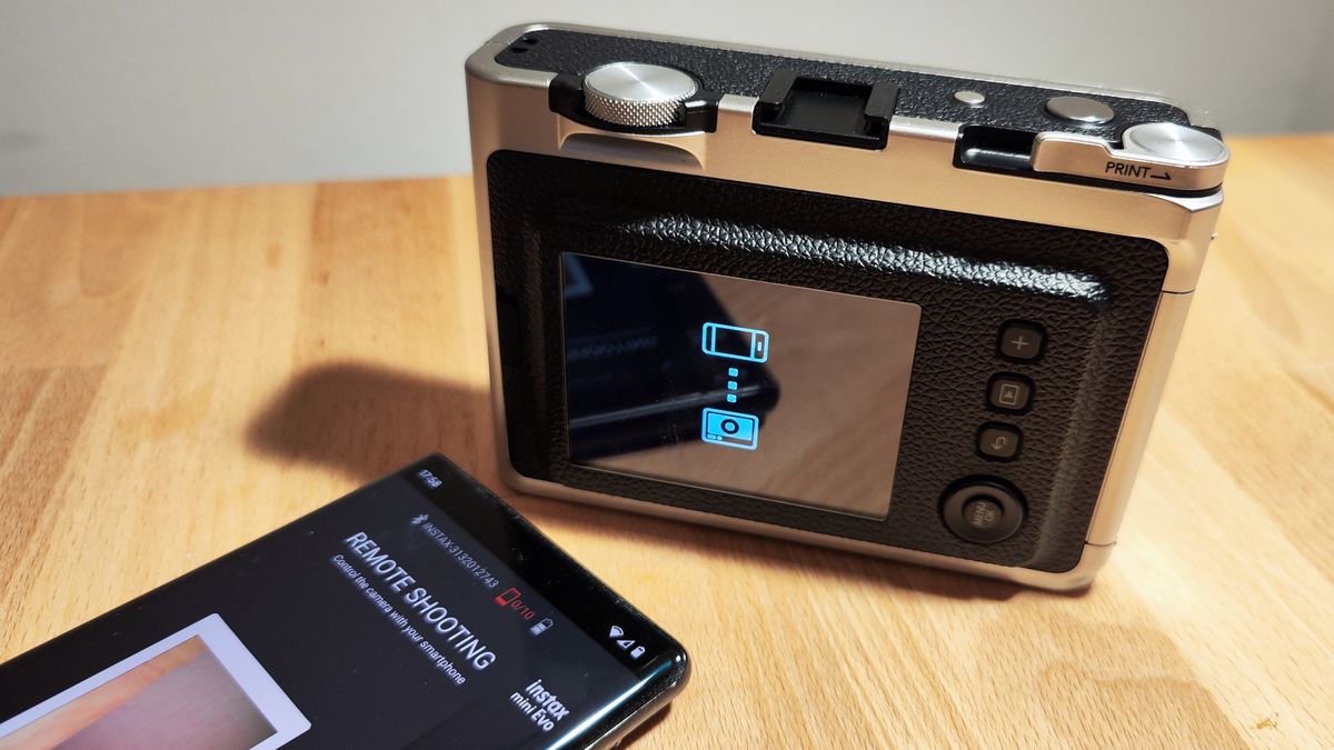 Instant photos on a wooden table