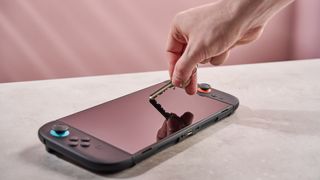 Pushing key against the DBrand Prism 2.0 for Nintendo Switch 2