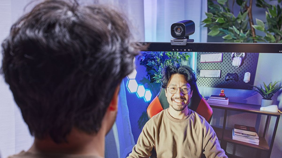 HyperX Vision S Webcam with a picture of a man displayed on a computer