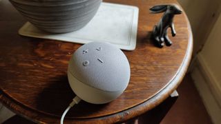 Amazon Echo Dot on a wooden table 