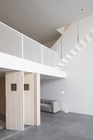 detail of mezzanine of minimalist workspace Venice Lofts by Part Office