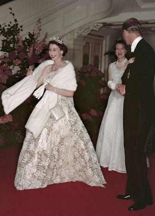 Queen Elizabeth II and Prince Philip leave a banquet during their Commonwealth visit to Australia