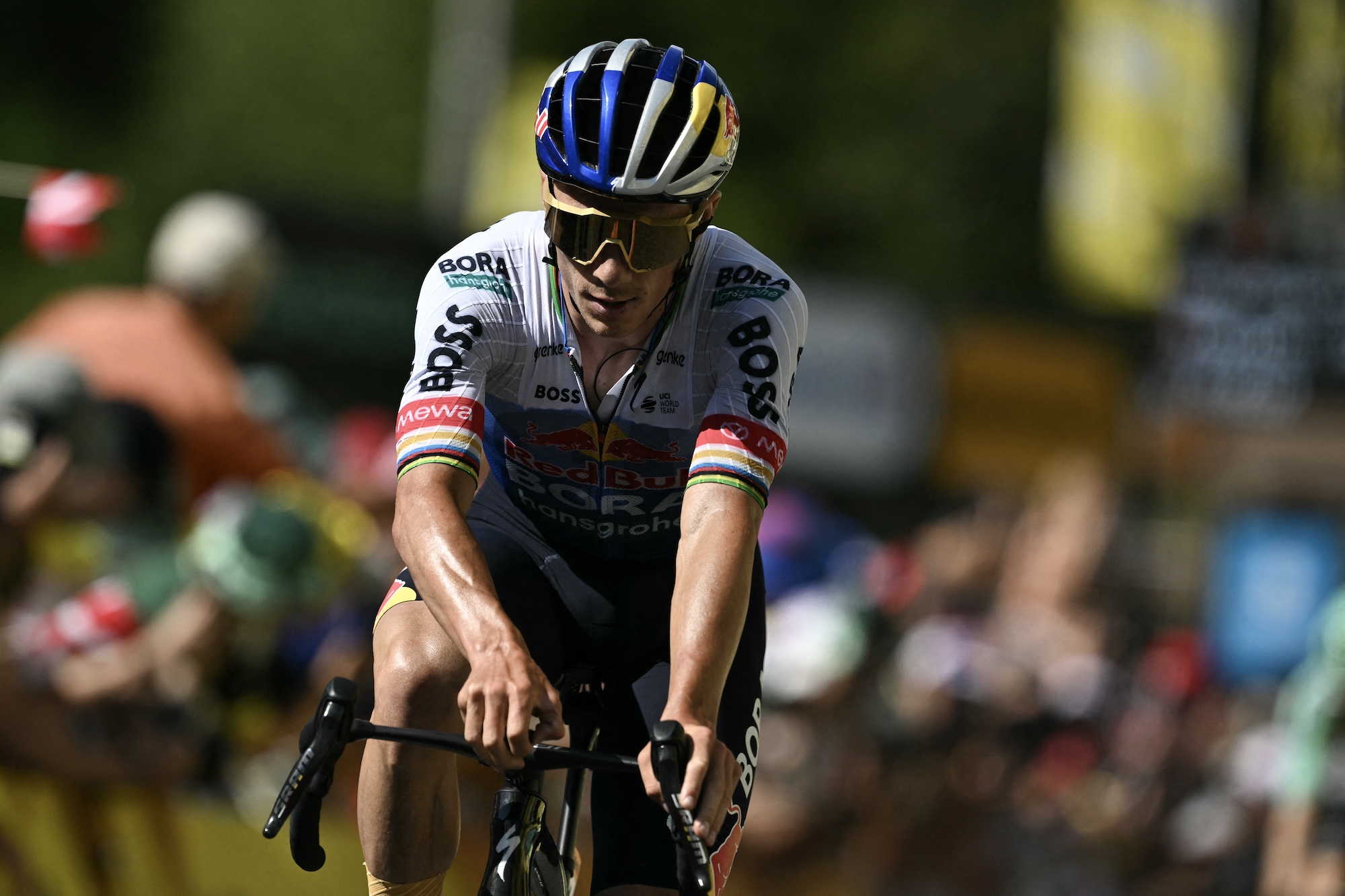 Remco Evenepoel crosses the line at the end of stage 11