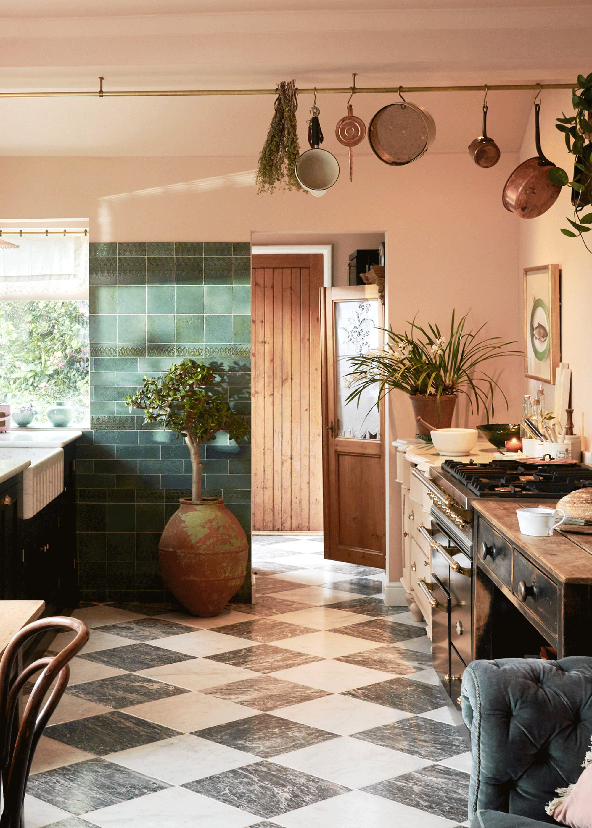 pink kitchen with chequerboard floor