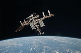 This historic photo of the International Space Station and the docked shuttle Endeavour flying together 220 miles above Earth was taken by astronaut Paolo Nespoli from a departing Soyuz spacecraft on May 23, 2011. It is the first-ever view of a NASA shutt