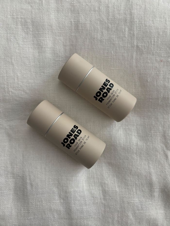 The Jones Road Your Skin Foundation Stick on a white linen background