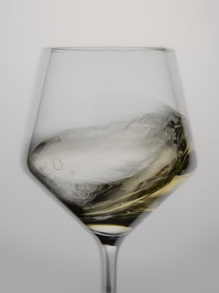 White wine swirling around the glass