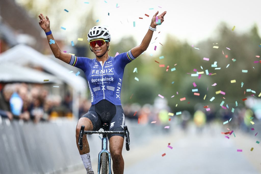 Ceylin Del Carmen Alvarado celebrates as she crosses the finish line 