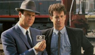 Dragnet Dan Aykroyd and Tom Hanks present evidence to a suspect