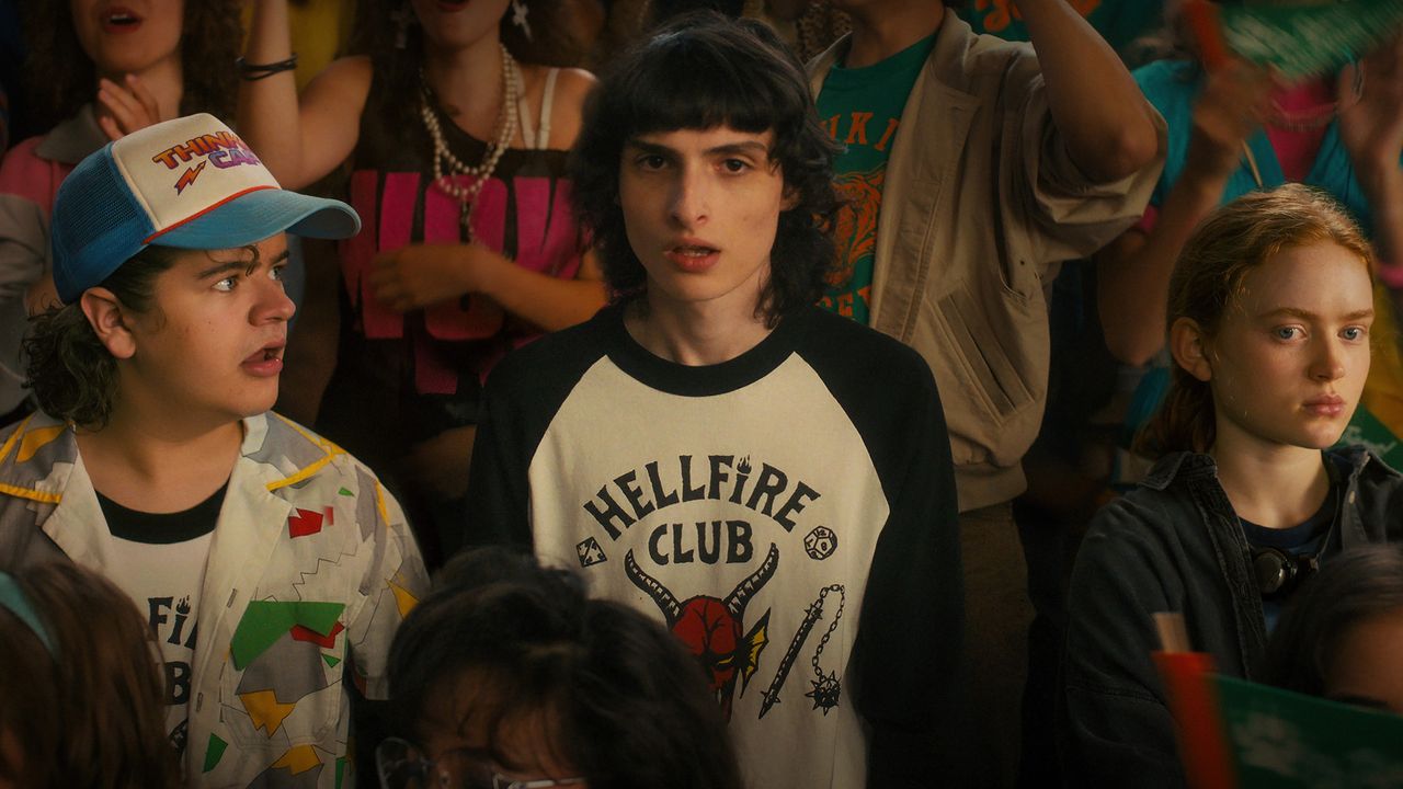 Gaten Matarazzo, Finn Wolfhard and Sadie Sink in stands in Stranger Things