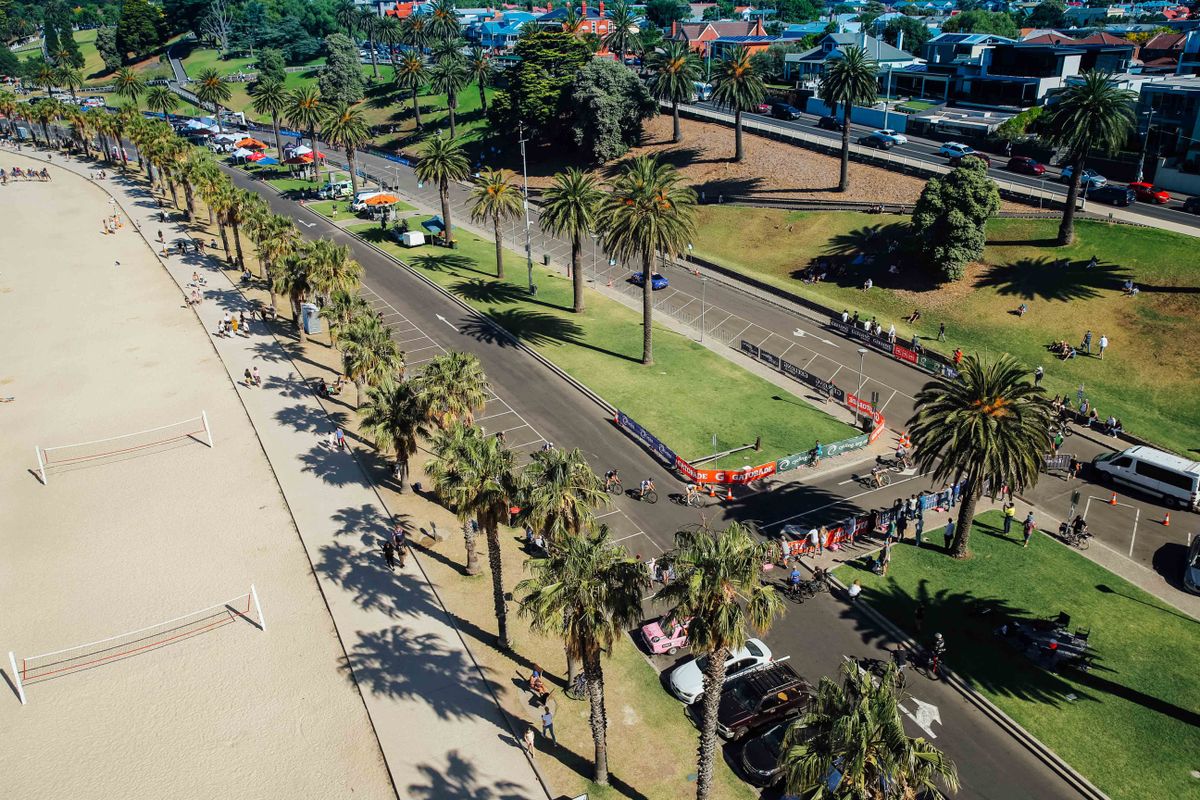 Overhead shot of the peloton racing by
