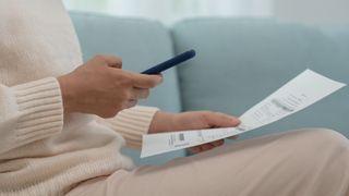 A picture of someone holding a phone up to a document