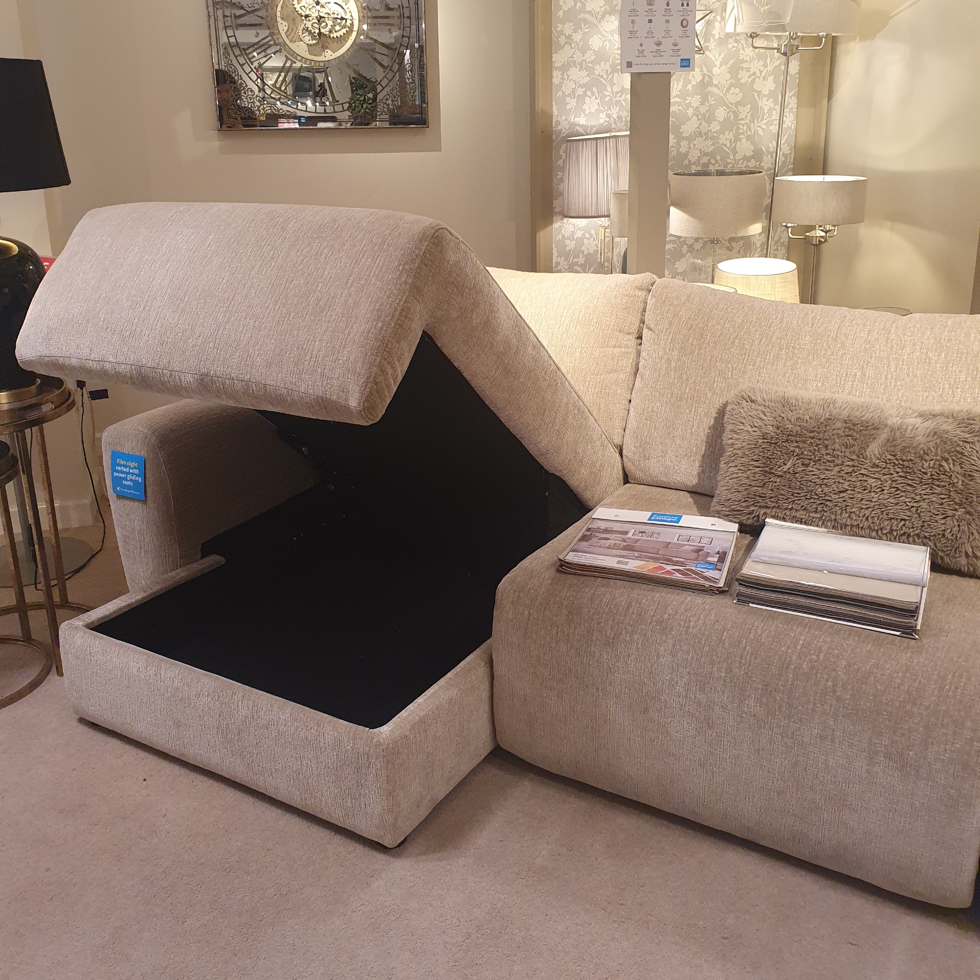 The Ideal Home Gemini sofa with an open storage chaise at a Furniture Village store