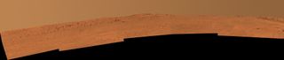 The boulder-studded ridge in this scene recorded by NASA's Mars Exploration Rover Opportunity is "McClure-Beverlin Escarpment." This view toward the south is a mosaic of images taken by Opportunity's panoramic camera (Pancam) on Dec. 25, 2013.