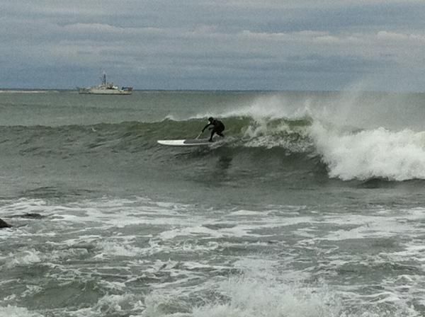 Mike Broderick surfs a 12-footer
