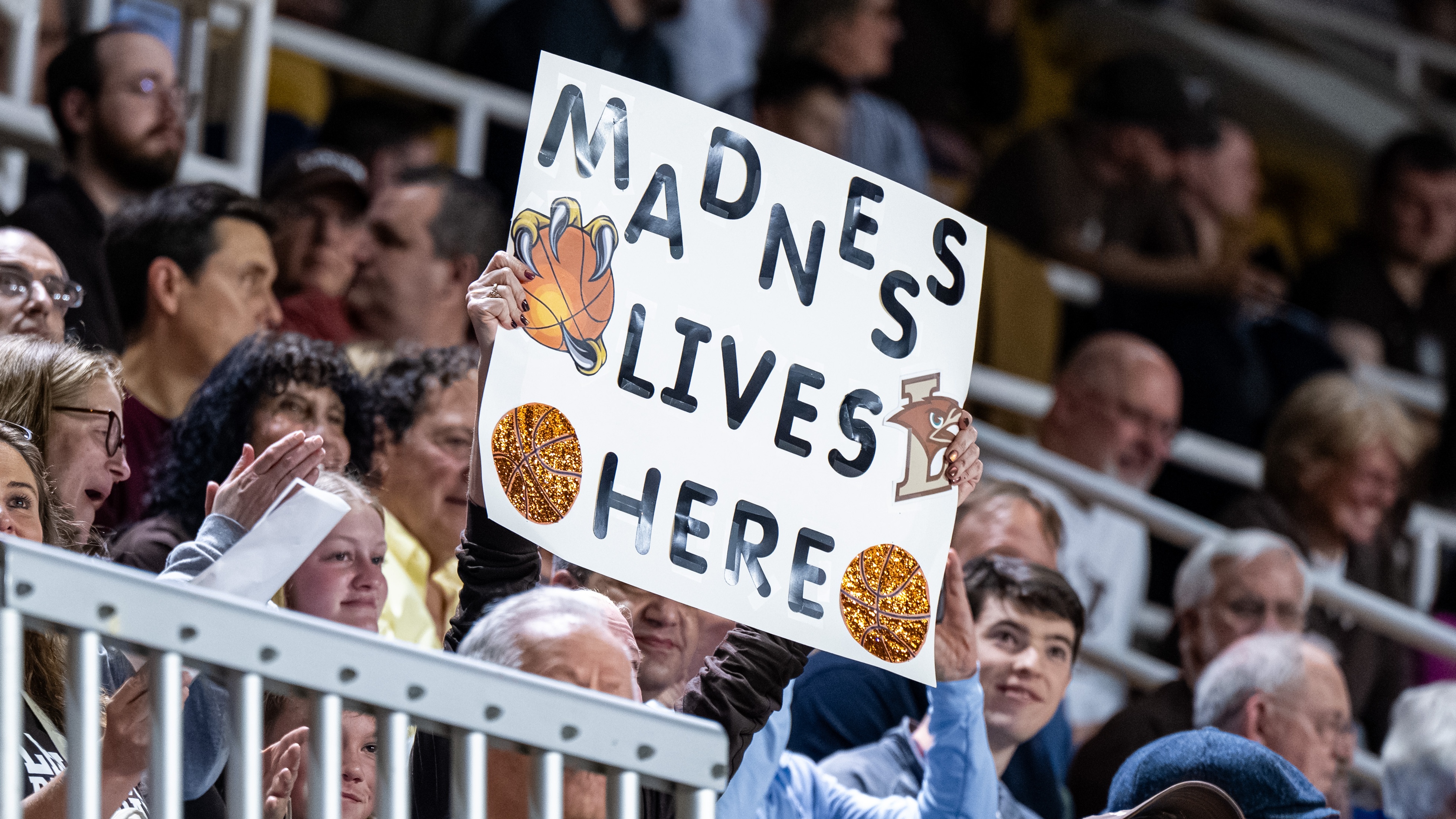 A Lehigh Mountain Hawks fan holds up a sign reading ''MADNESS LIVES HERE'' during the 2026 Patriot League Men's Basketball Championship game at Stabler Arena in Bethlehem, United States, on March 10, 2026 (Photo by Dan Squicciarini/NurPhoto via Getty Images).