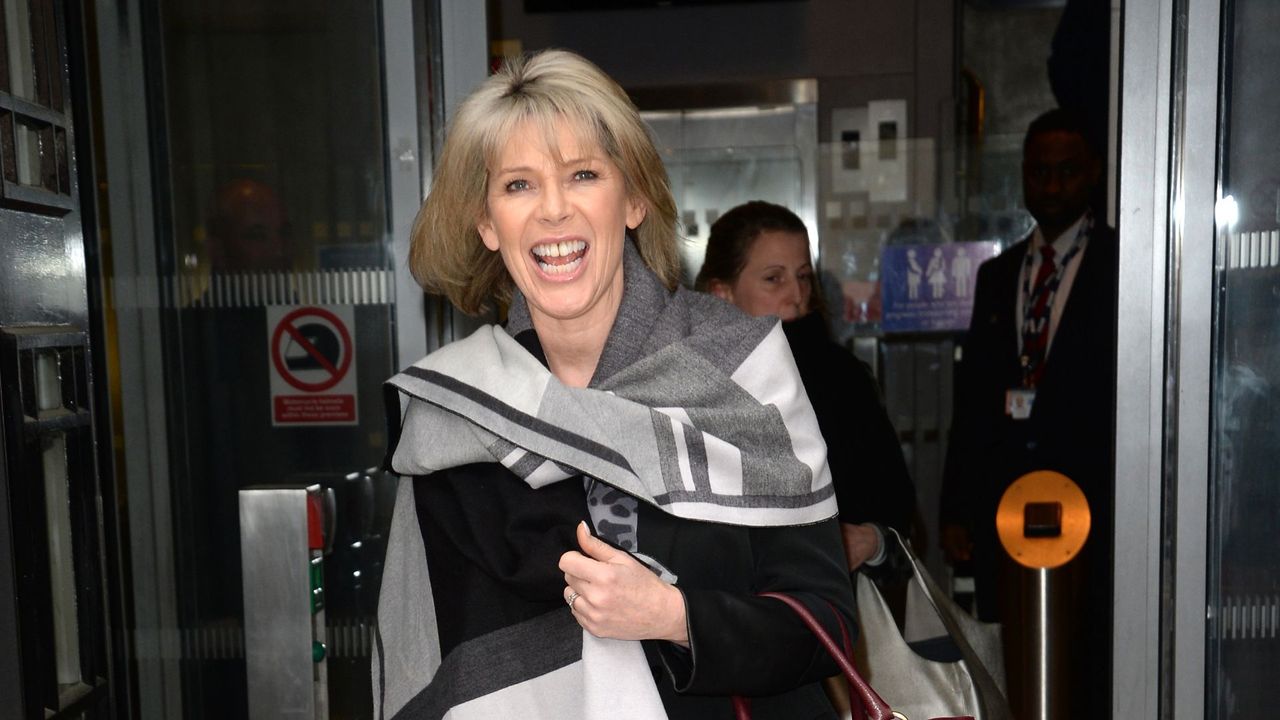 Ruth Langsford wearing checked scarf and burgundy handbag