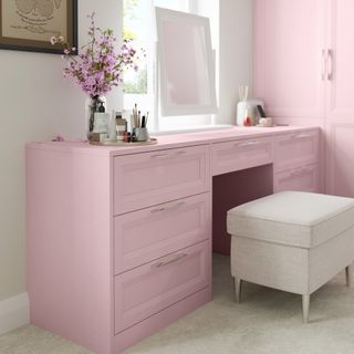 Pink dressing table in grey bedroom