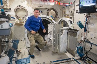 NASA astronaut Shane Kimbrough seen floating next to the airlock in Japan's Kibo module on the International Space Station.