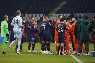PSG players follow Basaksehir's players off the field during their Champions League tie in Paris