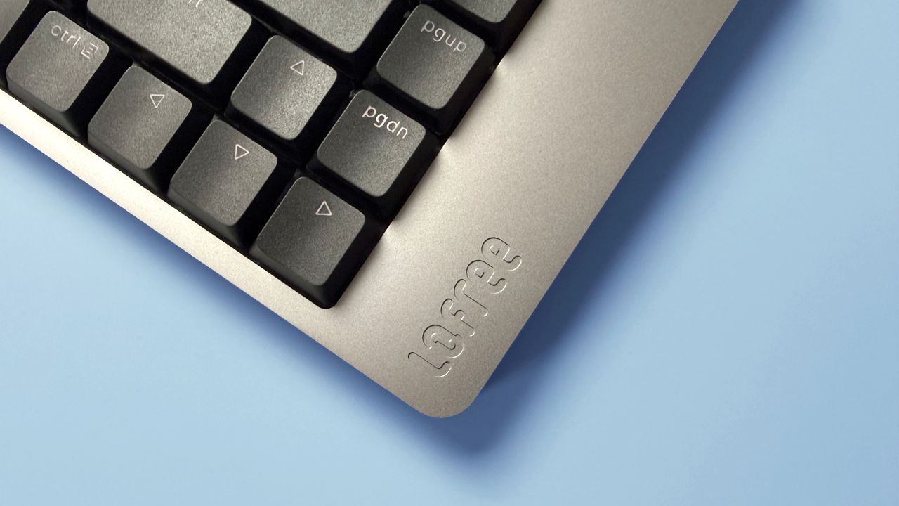 Lofree Flow 2 keyboard on a light blue background