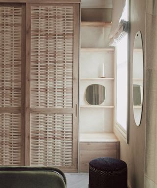 Hand woven wooden inbuilt wardrobe with simple shelving and wall mirror