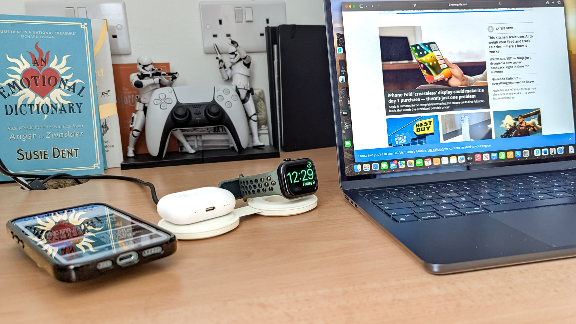 Satechi OntheGO Charger with iPhone, AirPods Pro 2 case and Apple Watch being charged on desk next to MacBook Air