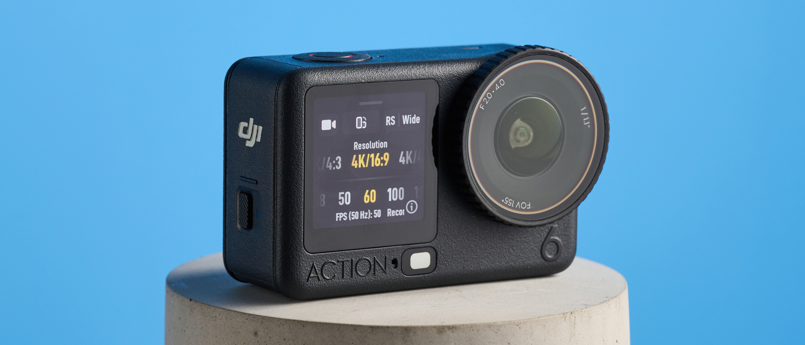 The DJI Osmo Action 6 on a stone surface with a blue background