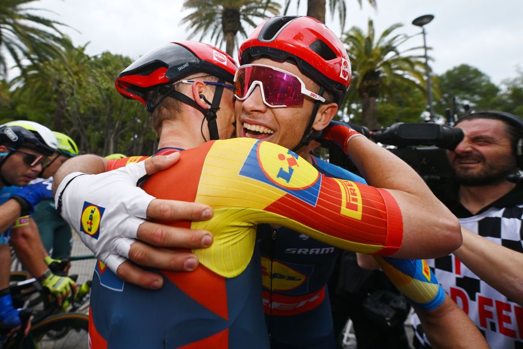 Stage winner Jonathan Milan hugs his Lidl-Trek teammate Simone Consonni