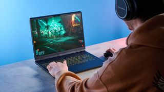 A blue Alienware 16X Aurora gaming laptop
