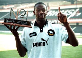 Paulo Wanchope of Derby County celebrates with his October 1997 Premier League Player of the Month award