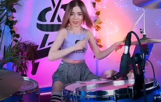 A still from Anastasia Sereda's video for her drum cover of Slipknot's Wait and Bleed