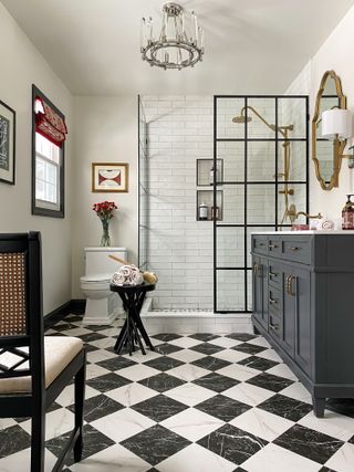 A bathroom with black and white checkered tiles