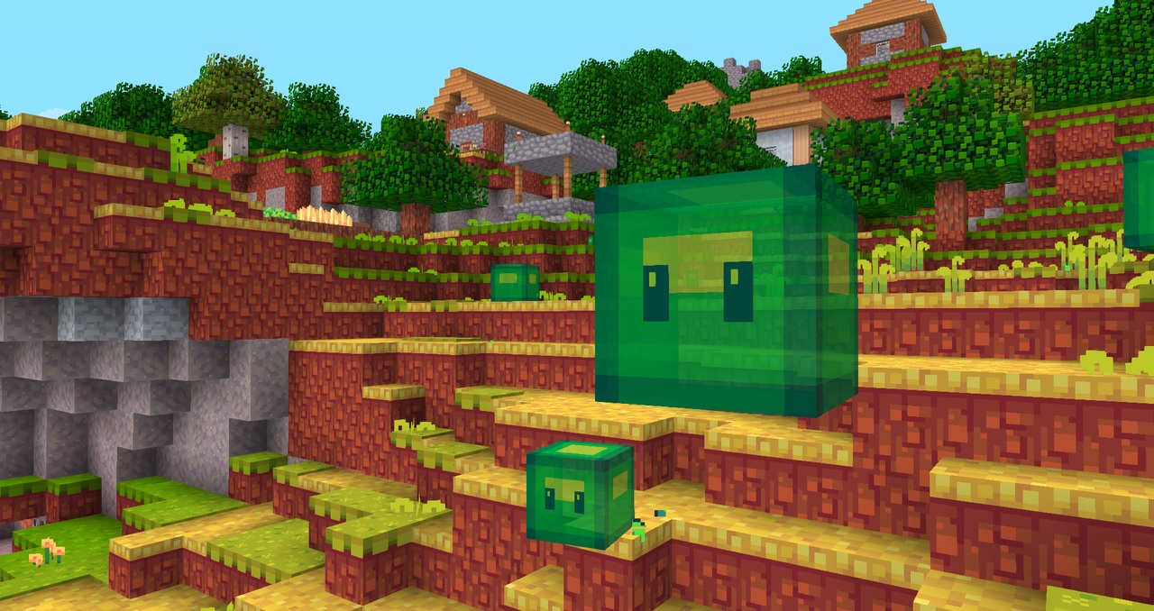 Minecraft texture pack Hafen - Two lime green slimes with cartoon eyes on a grass hill