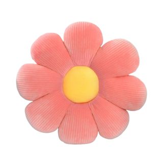 A flower cushion with pink petals and a yellow middle