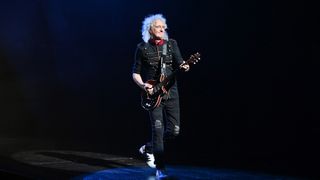 Queen guitarist Brian May performing.