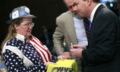 Sen. Mike Lee (R-Utah) (right) greets a supporter at the inaugural Senate Tea Party Caucus, which has just four members.