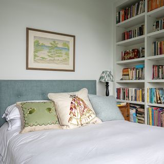 guest bedroom with beds and shelves