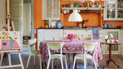 orange kitchen walls in converted cow byre home 