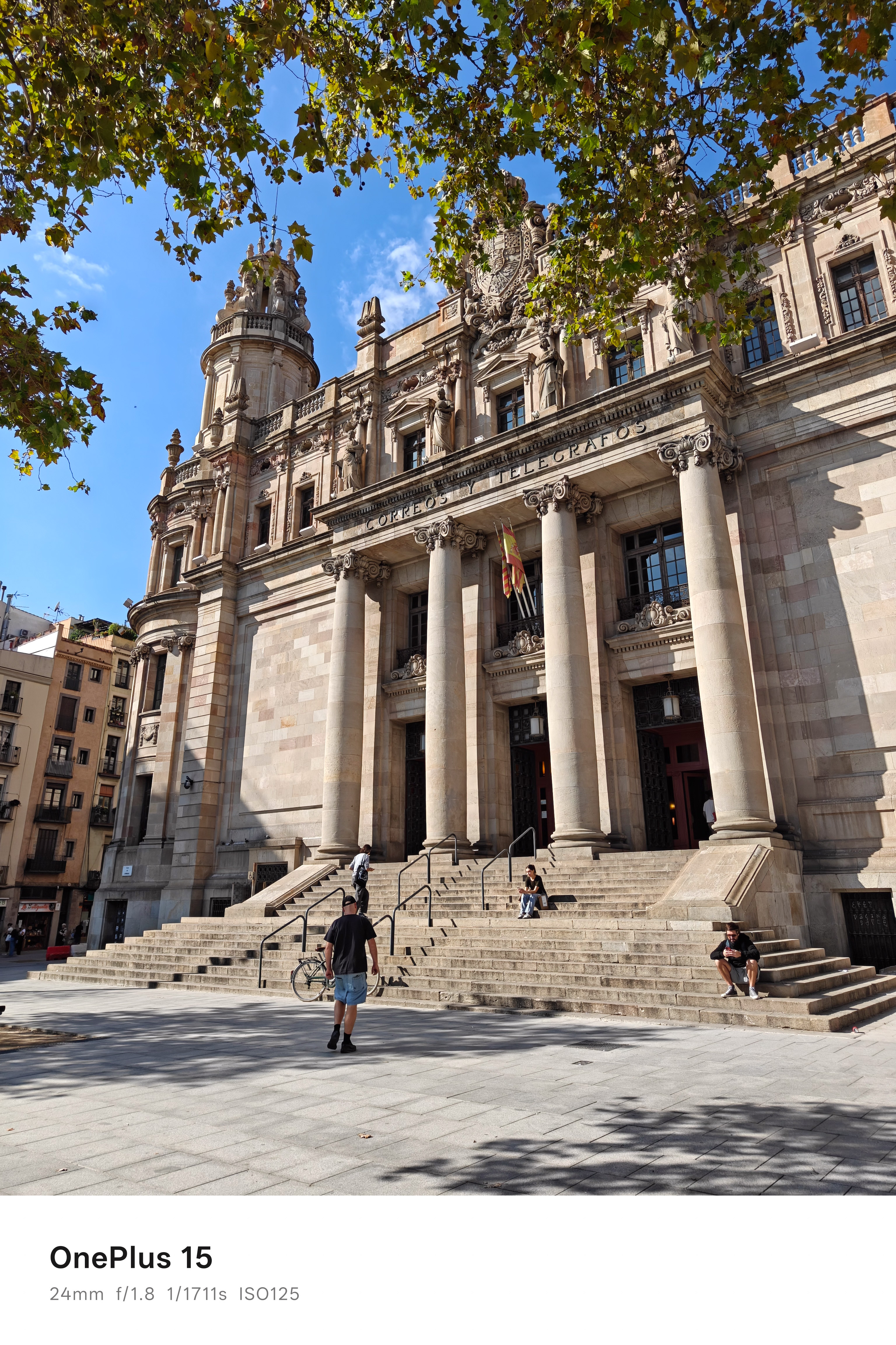A large stone building housing a post office in Barcelona, Spain