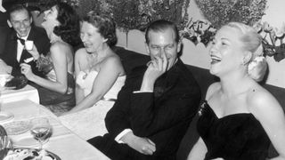 Left to right, Frank Sinatra, Ava Gardner (1922 - 1990), Mrs C.J. Latta, Prince Philip, Duke of Edinburgh and American opera singer Dorothy Kirsten enjoying an after dinner joke at a Variety Club of Great Britain benefit for the National Playing Fields Association, at the Empress Club, London, December 1951. Mrs Latta is the wife of a co-founder of the Variety Club of Great Britain