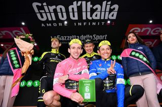 Mitchelton-Scott's Simon Yates and Esteban Chaves celebrate in their pink and blue jerseys, respectively, after Chaves took the stage win and Yates the overall lead on stage 6 of the 2018 Giro to Mount Etna