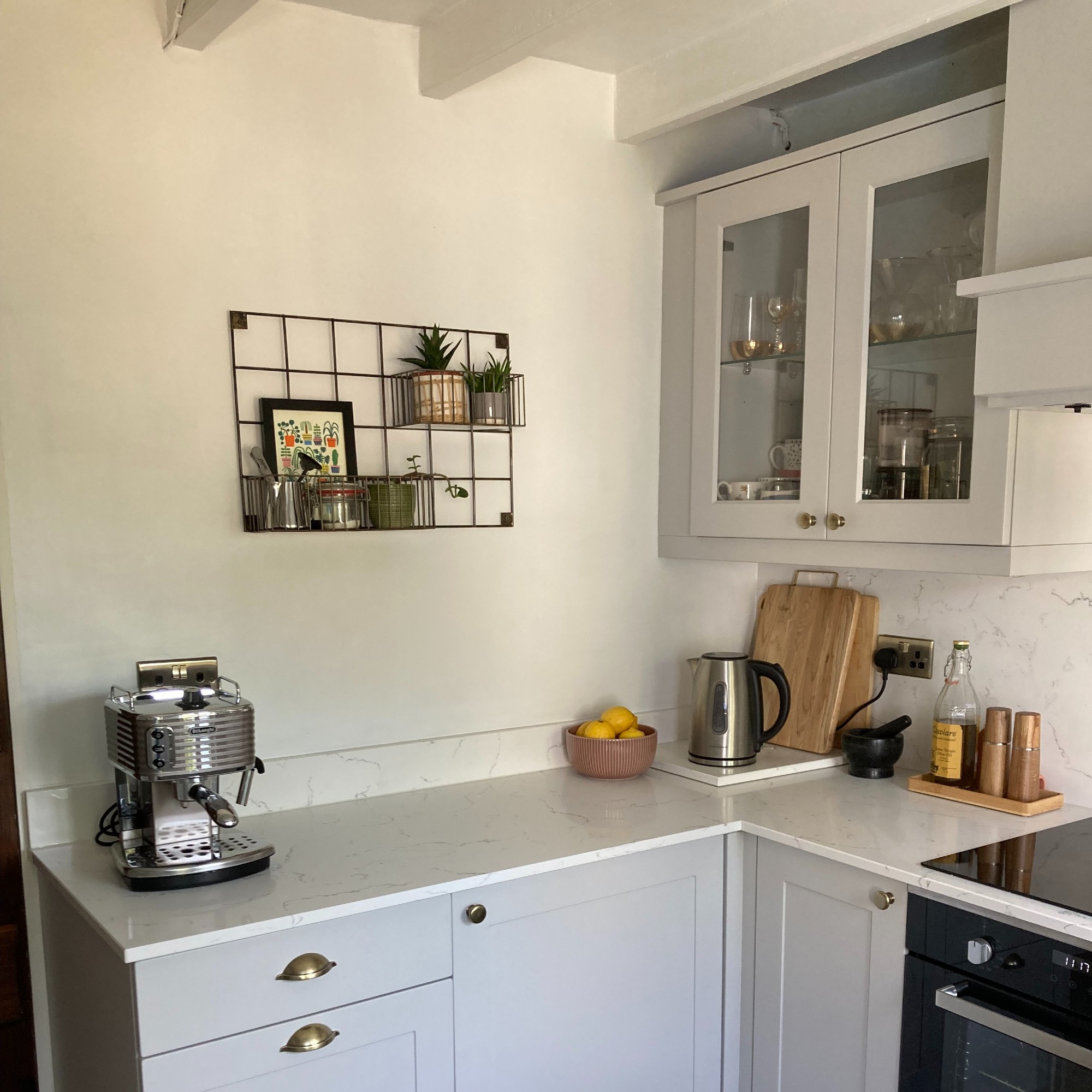Lindsey Davis' kitchen painted in Dulux White Mist with beams in Frenchic Wedding Cake