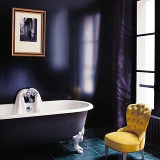 bathroom with bathtub and chair