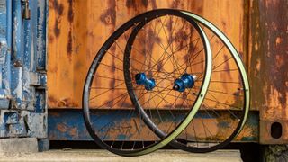 Hope Fortus 30 SC Pro 5 wheels outside a rusty shipping container